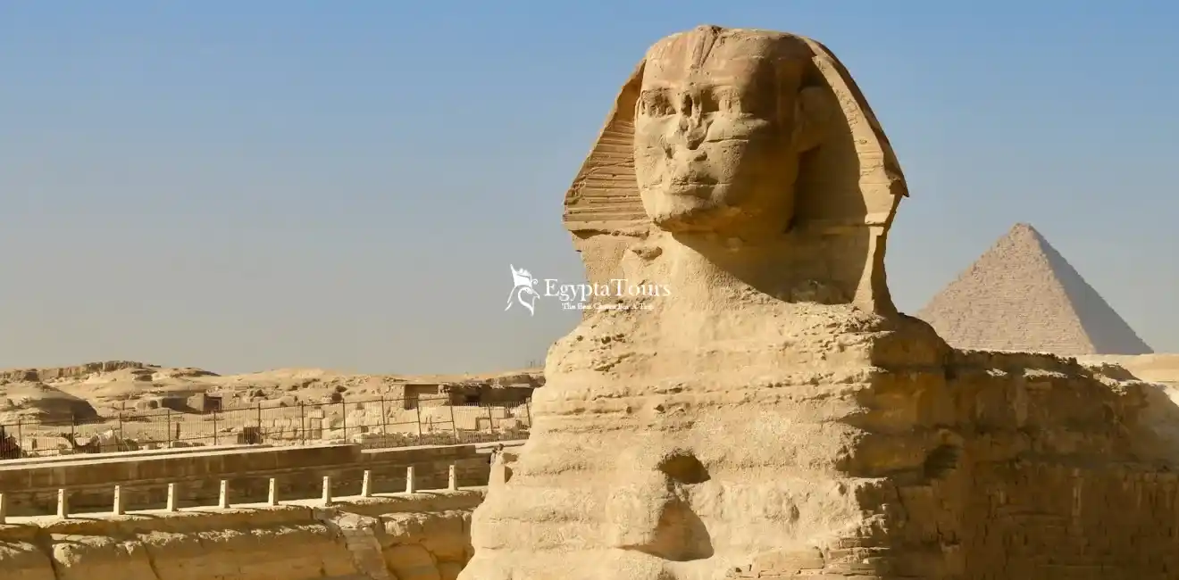 Giza Pyramids Complex 12 The-Great-Sphinx-of-Giza-carved-from-limestone-guarding-the-pyramids-EgyptaTours