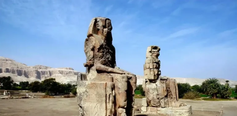 Colossi-Of-Memnon-Featured-Image-Giant-Statues-Of-Amenhotep-III-In-Luxor-EgyptaTours