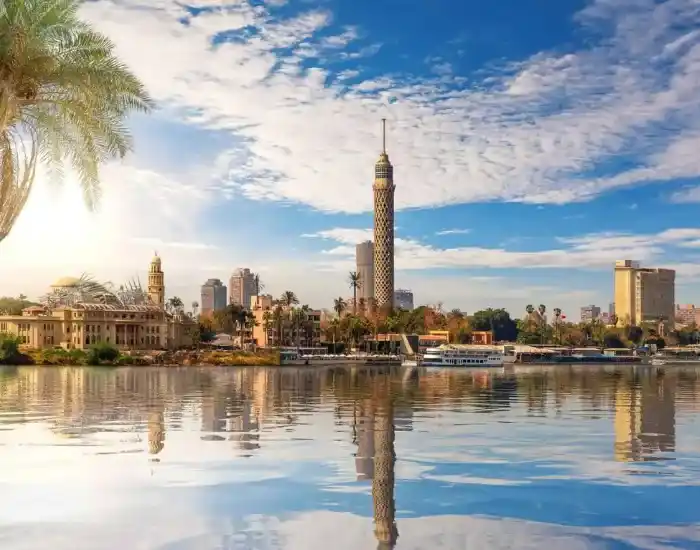 Cairo-Tower-And-City-Skyline-Reflecting-In-The-Nile-River-EgyptaTours