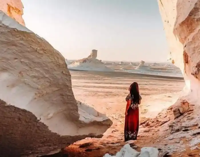 Tourist-Exploring-Giant-White-Chalk-Rock-Formations-In-The-Desert-EgyptaTours